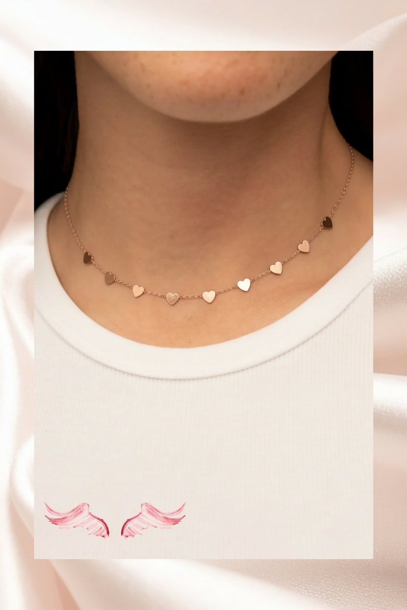 Woman wearing rose gold heart necklace