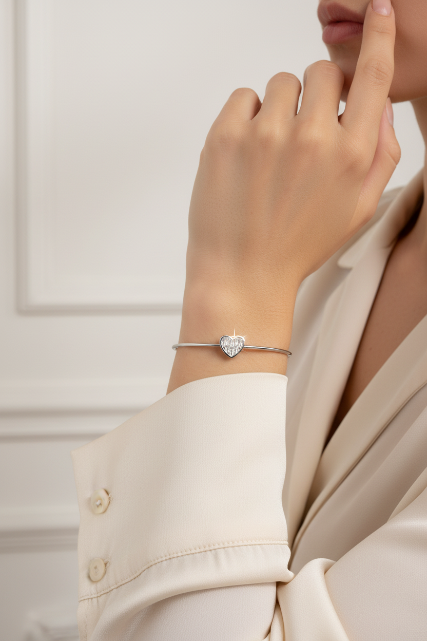 Woman wearing silver cuff bracelet with white crystals