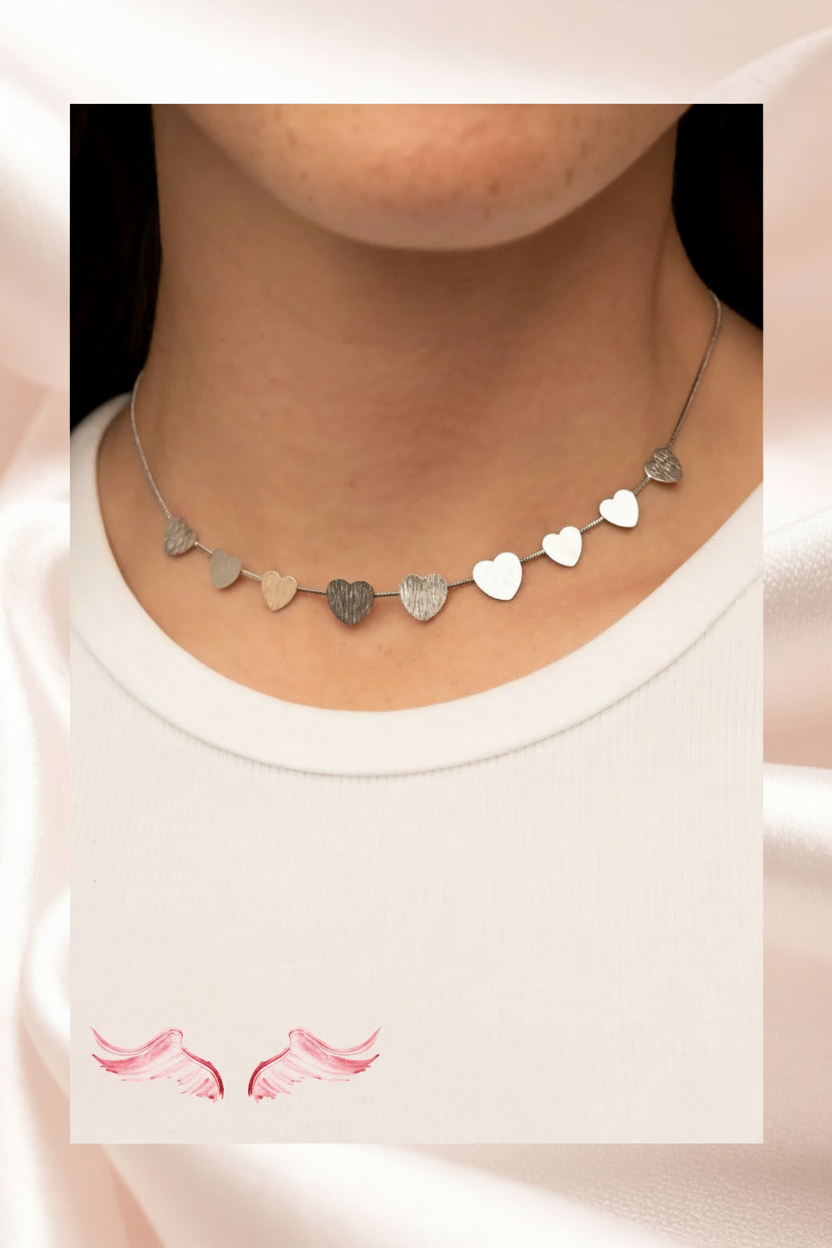 Woman wearing silver heart necklace